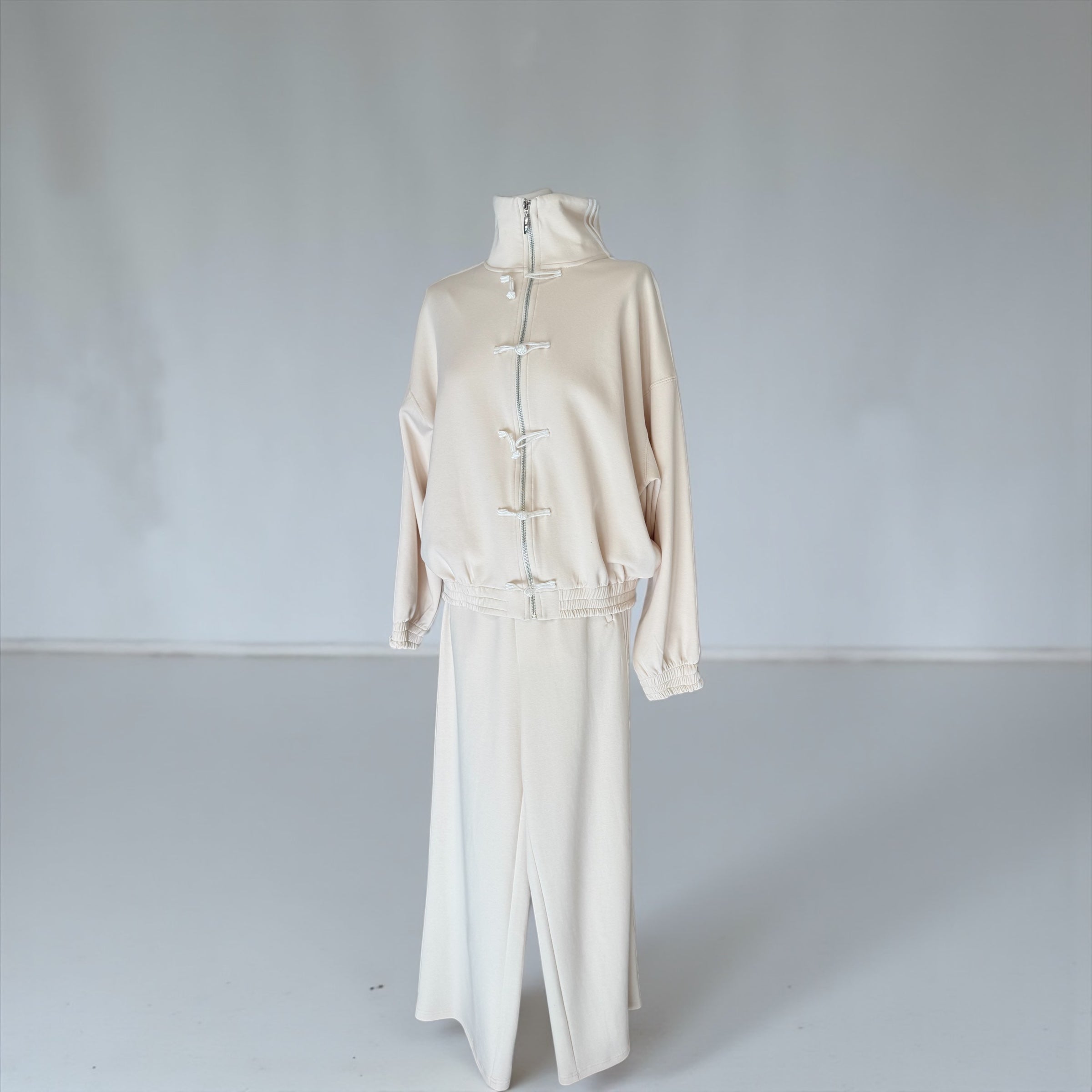 Pantalone crema banda laterale